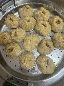Images of momos being steamed